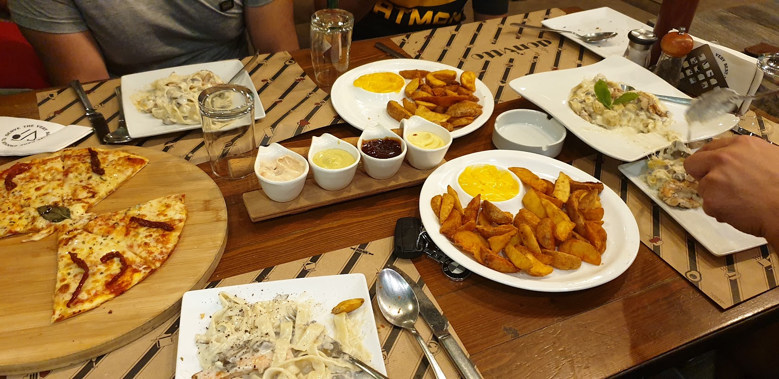 A full table of dishes at Donvitto, Tyre